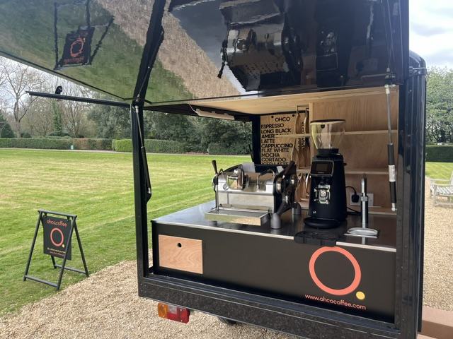 Espresso machine and grinder on the stainless bar inside the OHCO mobile coffee tuk tuk